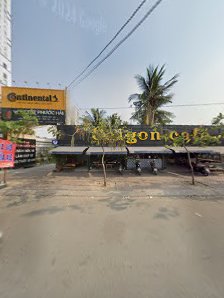 The image depicts the exterior of a venue in Thao Dien, Saigon. Visible elements include a yellow sign with 'Continental's' and other text, palm trees