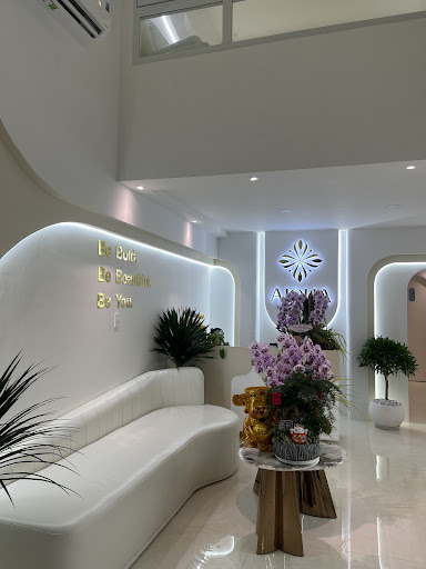 The image shows a modern and well-lit interior space within Thao Dien, Saigon. It features contemporary design elements such as sleek white furniture,