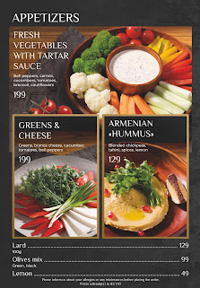 A menu page from a venue in Thao Dien, Saigon showcasing appetizers such as fresh vegetables with tartar sauce and Armenian hummus.