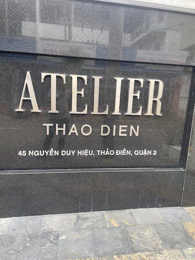 The image shows a signboard for 'Atelier Thao Dien', which appears to be the entrance or facade of an establishment located at 45 Nguyen Duong Hieu, D