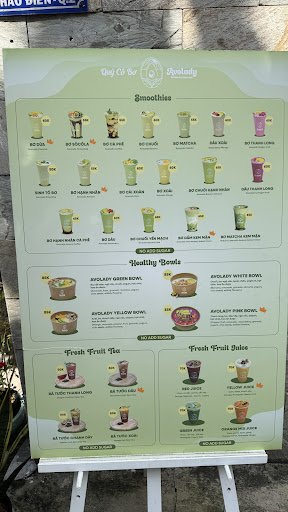 A menu board displaying various drink options such as smoothies and fruit juices at a venue in Thao Dien, Saigon.