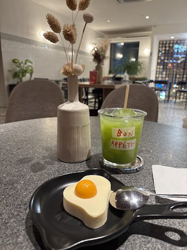 The image shows a dining table in an indoor setting that appears to be part of a restaurant or cafe named Thao Dien, Saigon.