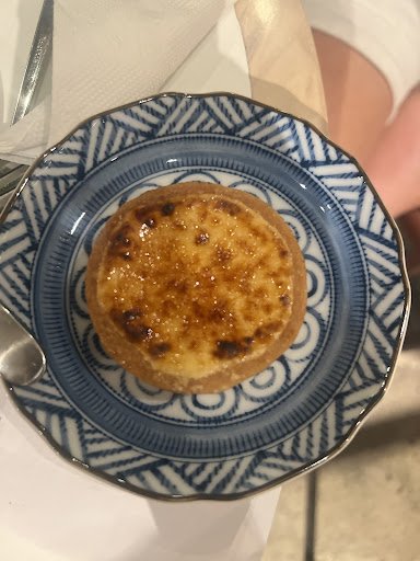 A dessert item, possibly a crème brûlée or custard tart