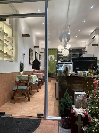 The image shows an interior view of a cafe or restaurant named 'Baan', which appears to be decorated for the holiday season with Christmas decorations
