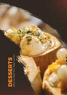 A close-up of a dessert menu featuring various sweet treats such as ice cream and pastries topped with seeds.