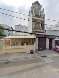 The image shows a street view of residential buildings in Thao Dien, Saigon.