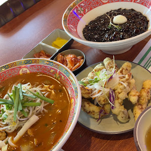 Vietnamese meal set with pho, spring rolls, and black rice
