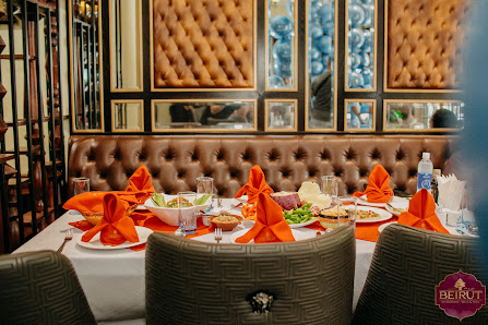 The image shows a well-set dining table in an upscale restaurant setting within Thao Dien, Saigon.