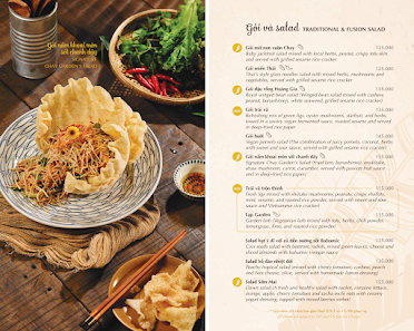 The image displays a restaurant menu from a venue in Thao Dien, Saigon. The left side features a food photograph showing a dish (likely a spring roll 