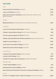 A menu displaying various wine options from different regions and countries.