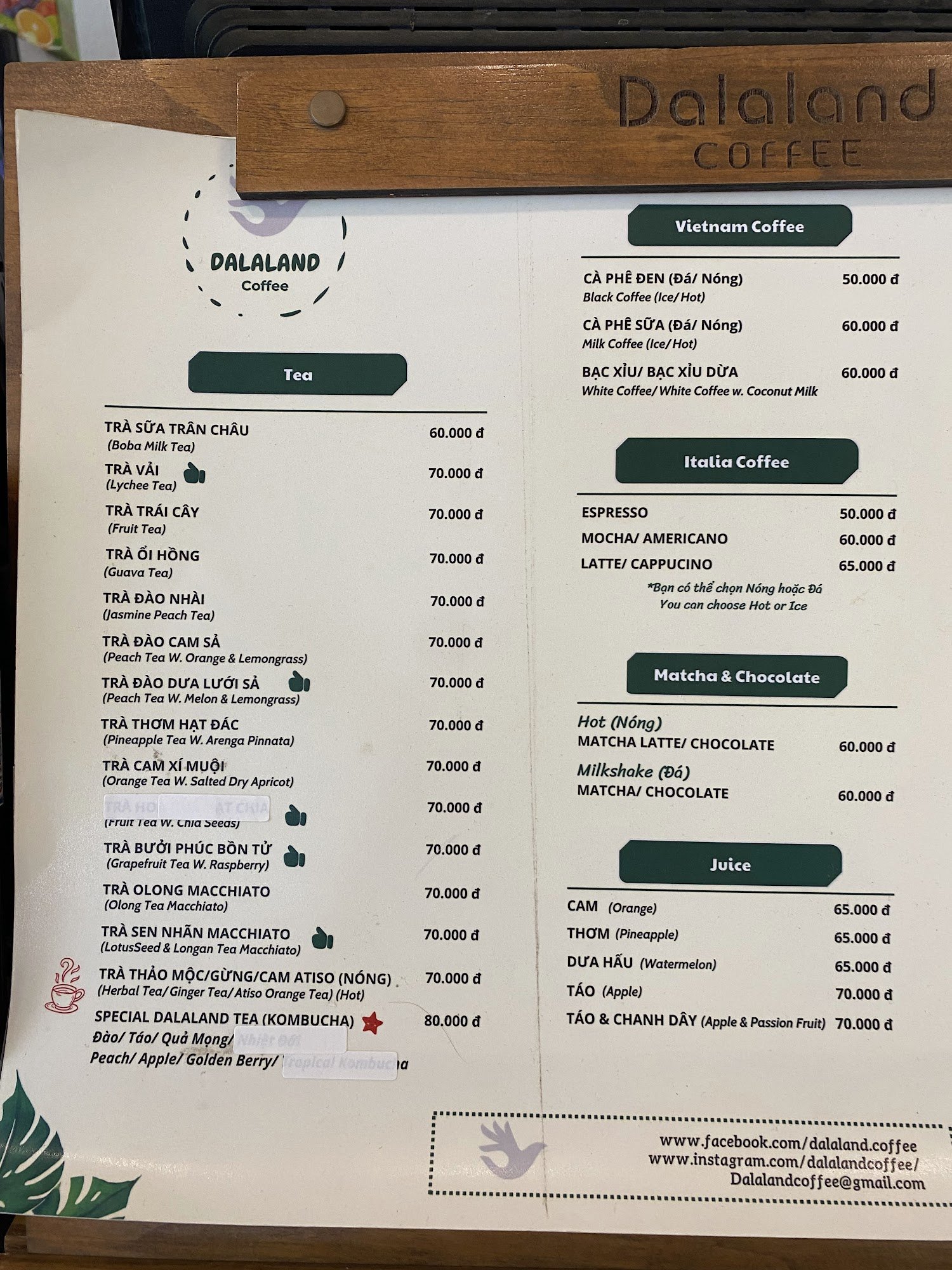 The image displays a menu board for Dalaland Coffee, located in Thao Dien, Saigon. It features multiple beverage categories: Tea, Vietnam Coffee, Ital