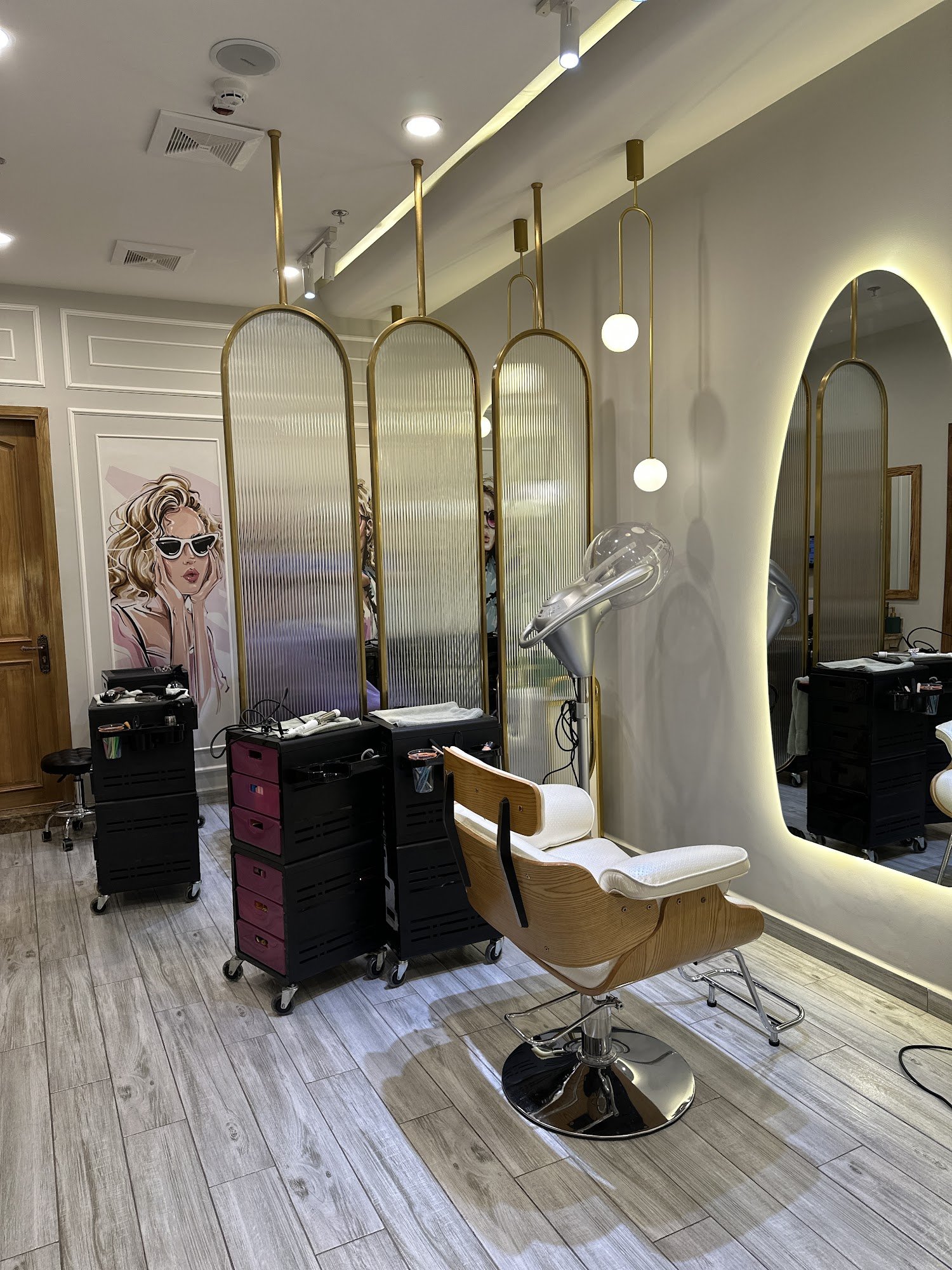 This image depicts a modern hair salon interior featuring stylish decor and professional equipment.