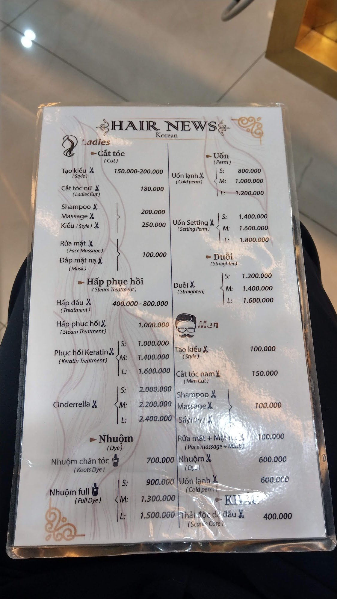 A menu for HAIR NEWS Korean hair salon, listing various hair services for Ladies and Men with prices in Vietnamese Dong (VND). Sections include Cắt tó