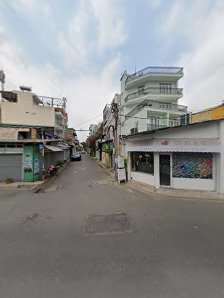 The image shows a street view of an urban area in Thao Dien, Saigon with various buildings and storefronts on either side.