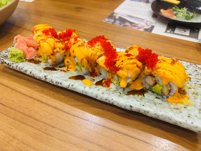 Sushi with yellow sauce and red roe