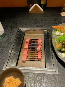The image shows a dining setup on a table in an indoor venue, likely a restaurant or cafe.