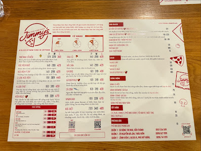 A menu from a pizza restaurant named 'Jimmy's' displayed on a wooden table.