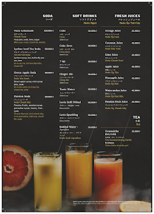 A menu from a venue in Thao Dien, Saigon featuring various beverage options including soda drinks and soft drinks with corresponding images of the bev