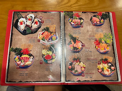 The image shows a menu from Thao Dien, Saigon featuring various dishes presented in colorful bowls with ingredients such as vegetables and noodles vis