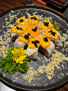 Sushi Rolls with Yellow Sauce and Black Caviar