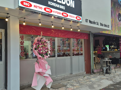 The exterior of a Korean BBQ restaurant located on the ground floor at an urban street corner in Thao Dien, Saigon.