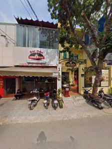The image shows an exterior view of a building in Thao Dien, Saigon with signage indicating it is likely a restaurant or cafe named 'Bai Cafe'. There