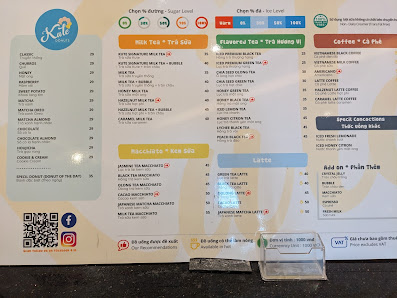A menu board displaying various beverage options such as tea and coffee in a venue named Thao Dien, Saigon.