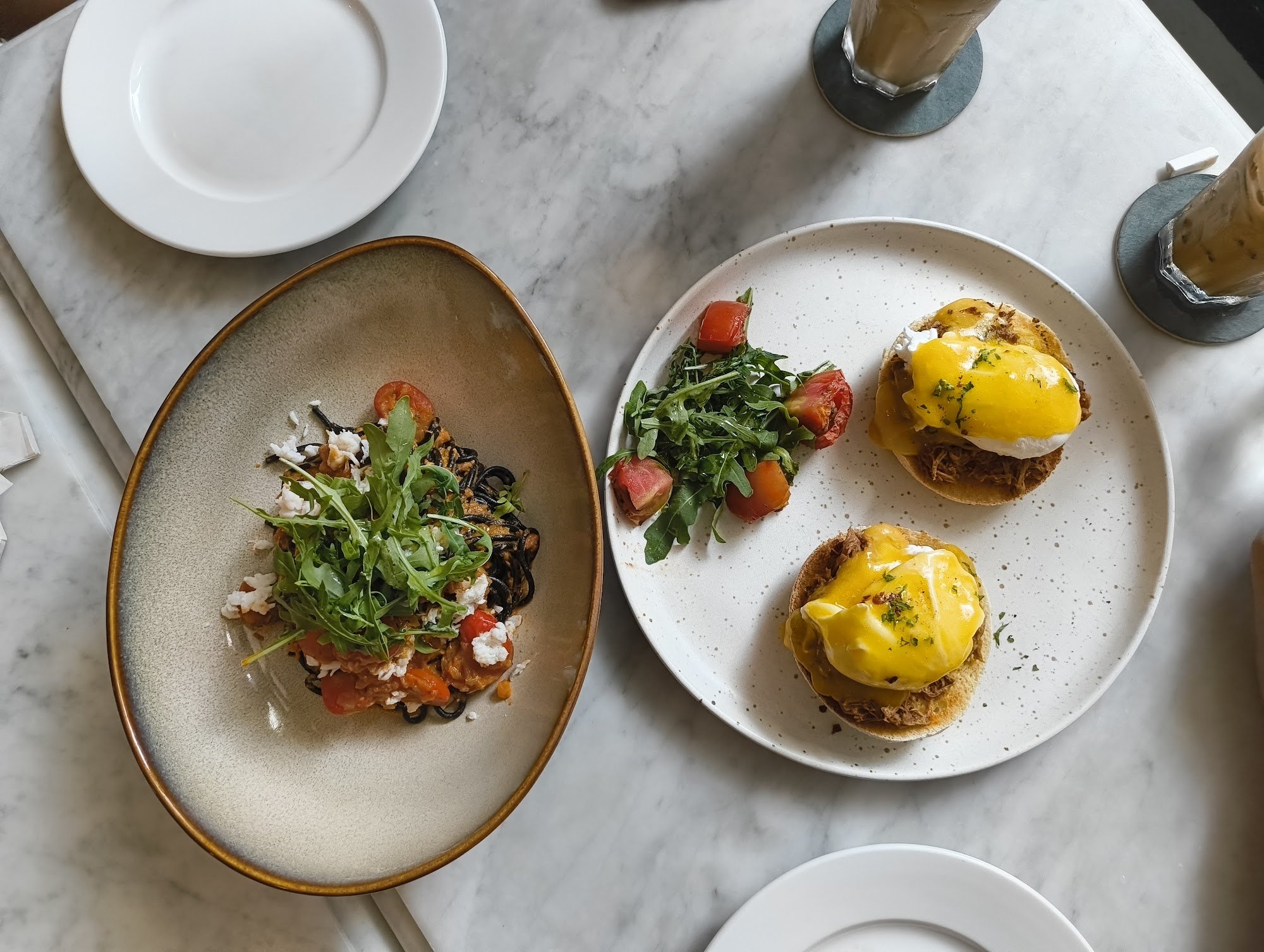 Eggs Benedict and Black Pasta with Arugula