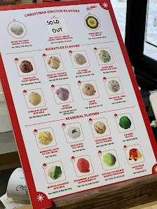 A menu board for a venue in Thao Dien, Saigon, featuring sections like 'CHRISTMAS DINNER SPECIALS', 'MONKEYS LUNCH', and 'BREAKFAST FAVORITES'. Each s