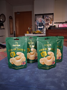 The image shows a room setting where several packages of 'Cheese King' brand cheese crackers are displayed on a blue surface, likely a table or counte