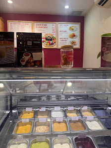 The image shows an interior view of a dessert shop or ice cream parlor at Thao Dien, Saigon.