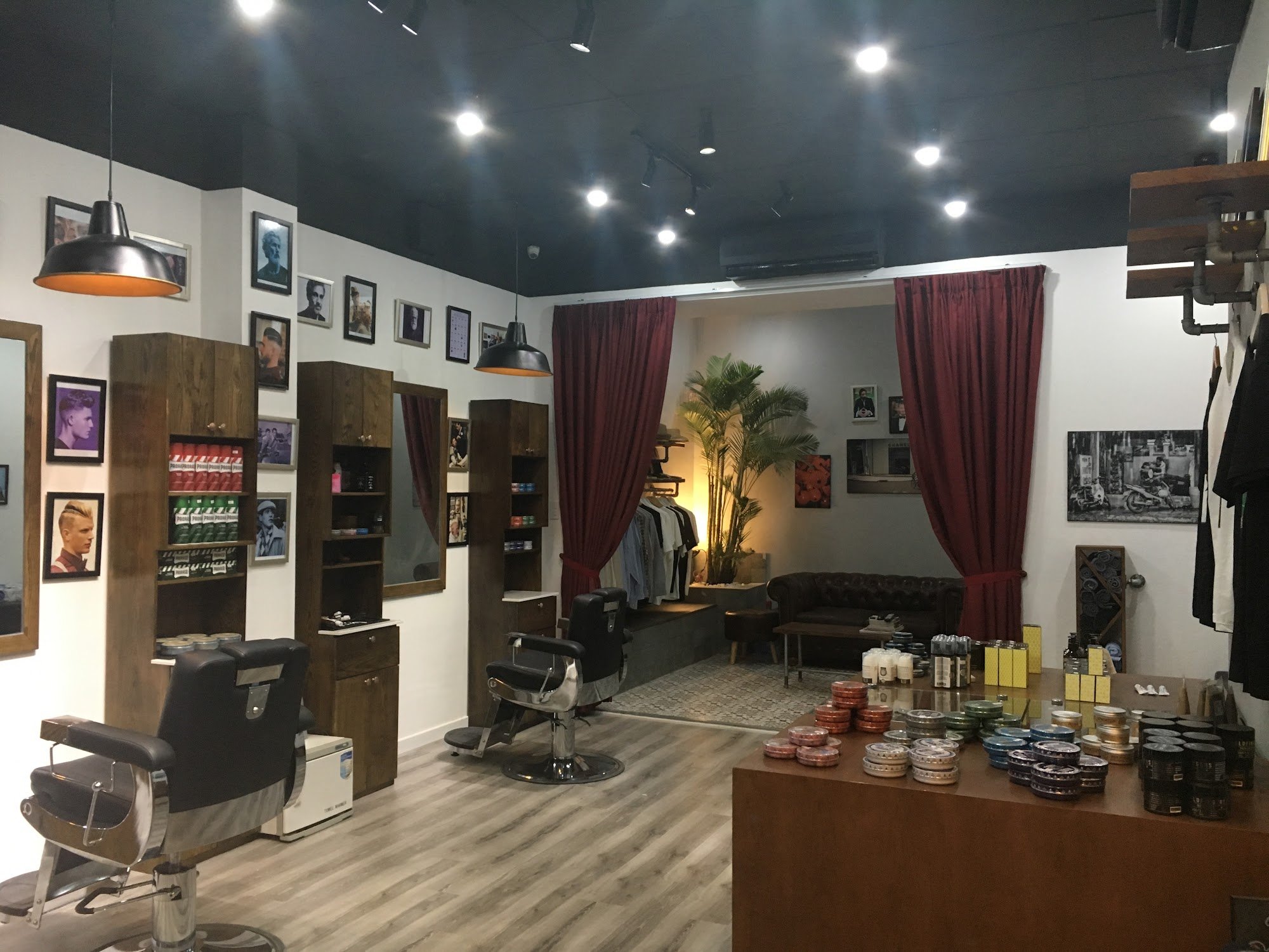 The image depicts an interior view of a barbershop or hair salon named Thao Dien in Saigon.