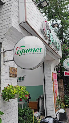 The image shows an exterior view of a restaurant named 'Legumes', which appears to be located in Thao Dien, Saigon.