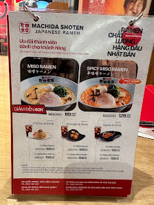 A menu board for Machida Shoten, a Japanese ramen restaurant in Thao Dien, Saigon. Features images of ramen dishes (Miso Ramen, Spicy Miso Ramen) with