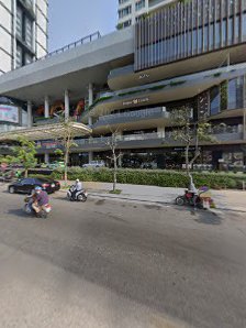 The image shows a street view of an urban area in Thao Dien, Saigon with modern buildings and vehicles on the road.