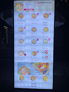 A vertical menu board for "MARGARITA LION" restaurant, displayed in Thao Dien, Saigon. Features multiple food items with images, names, and prices. In