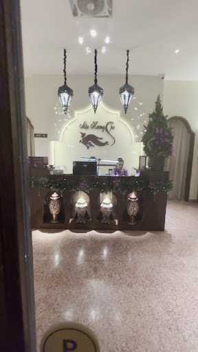 The image shows an interior view of a reception area in what appears to be a hotel or upscale establishment named 'Hiep Hung Hotel'. The decor include