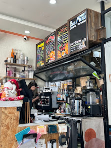 The image shows an interior view of a coffee shop or cafe named 'Bee Menu', which appears to be located in Thao Dien, Saigon. The counter is equipped 