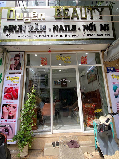 The image shows an exterior view of a beauty salon named 'Duong Beauty' located on the ground floor of a building in Thao Dien, Saigon.