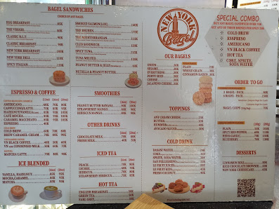 A menu from a cafe or restaurant named 'The New York Bagel' featuring various food and drink options such as bagels, sandwiches, smoothies, coffee-bas