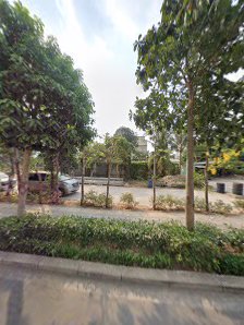 The image shows a street view of an area in Thao Dien, Saigon with trees and parked cars on the side.