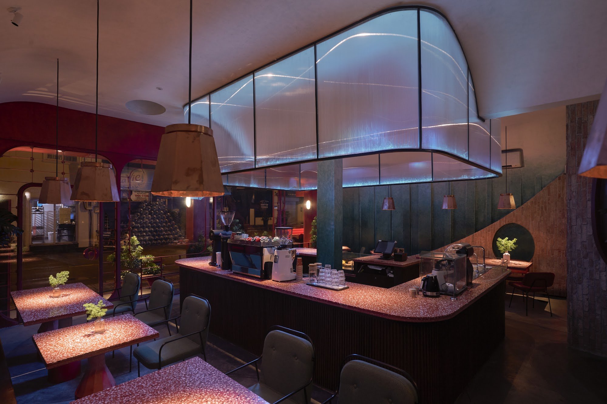 This image depicts a modern and stylish interior of what appears to be a high-end restaurant or bar in Thao Dien, Saigon. The space features contempor