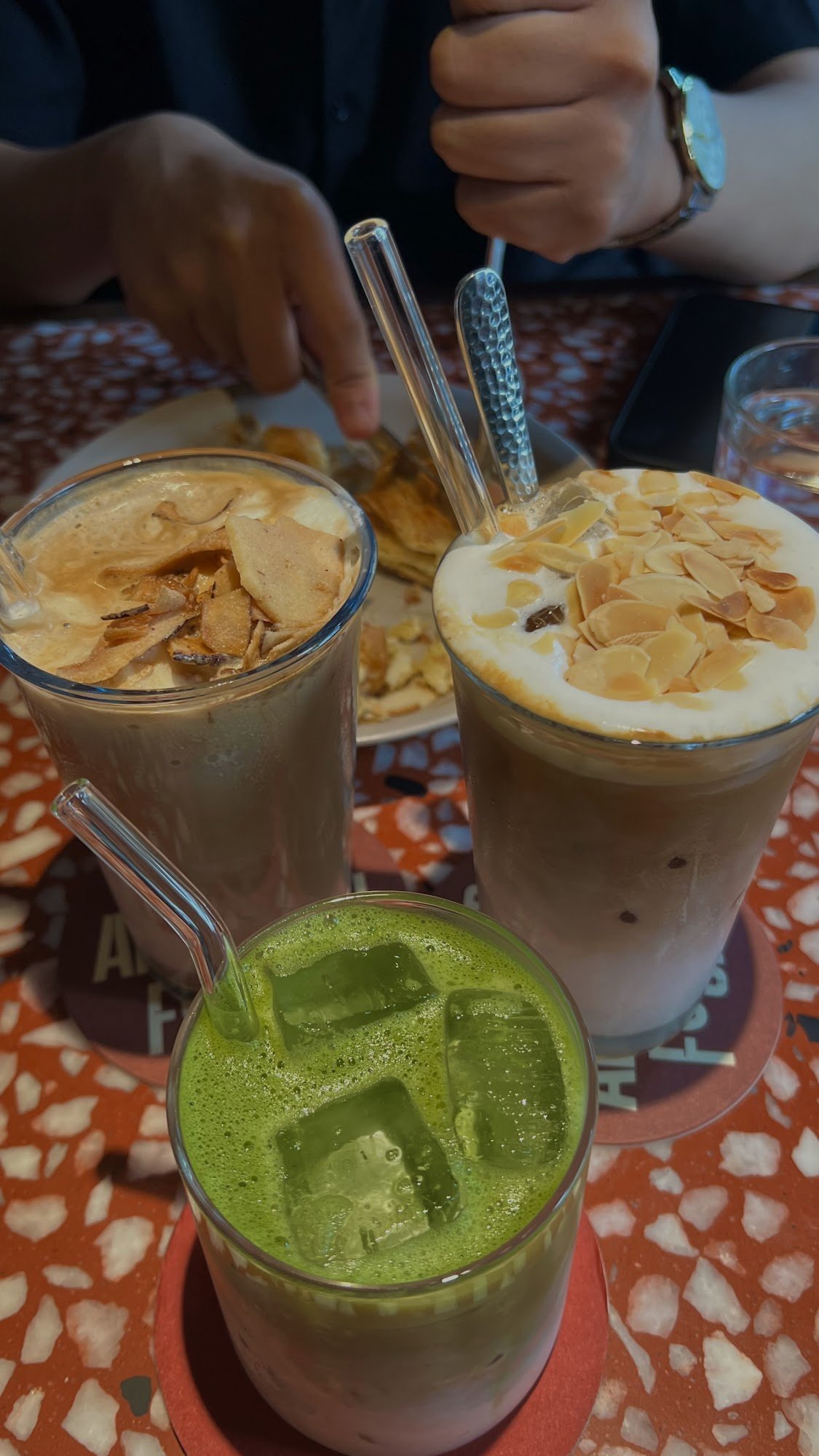 A close-up of three different beverages on a table at Thao Dien, Saigon.