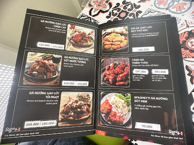 The image shows a menu from Thao Dien, Saigon featuring various dishes such as Ga Nướng Gà Lão Luc and Spaghetti Ga Nướng Gà Lão.