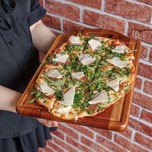 Pizza with greens and cheese