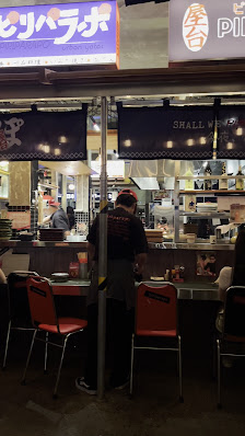 The image shows an exterior view of a Japanese-style restaurant at night time in Thao Dien, Saigon.