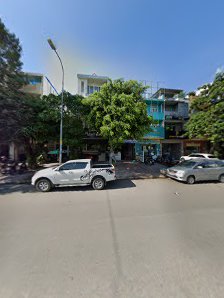 The image shows a street view of an urban area in Thao Dien, Saigon with parked cars and buildings on either side.