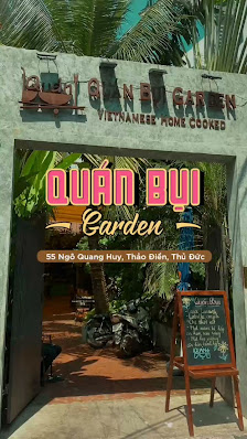 The image depicts the exterior entrance of "Quan Bui Garden," a Vietnamese home-cooked restaurant located at 55 Ngo Gia Thuy, Thao Dien, Thu Duc, Saig