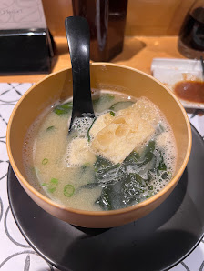 Soup with leafy greens and fried tofu