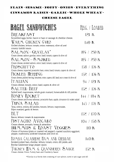 A black and white menu from Thao Dien, Saigon featuring various bagel sandwiches with their respective ingredients listed alongside the price per piec
